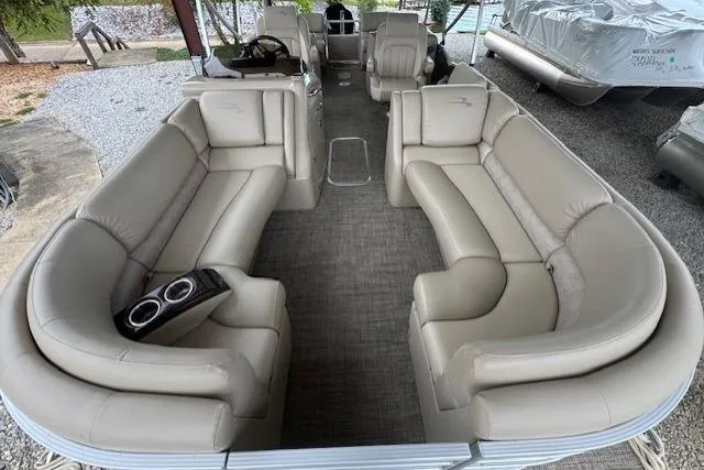 Slide: The Image of 2015 Bennington 2350 RSR pontoon boat with spacious beige seating and modern interior design. - 10