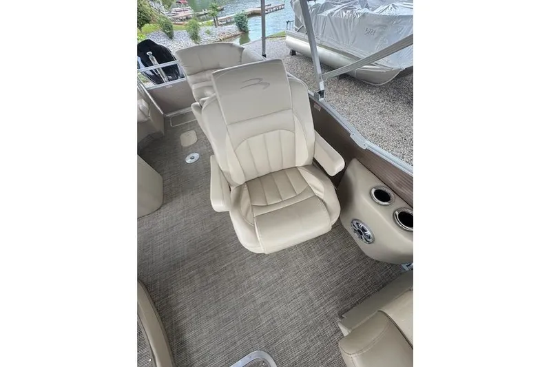 Slide: The Image of Luxurious seating on 2015 Bennington 2350 RSR pontoon boat with beige upholstery. - 17