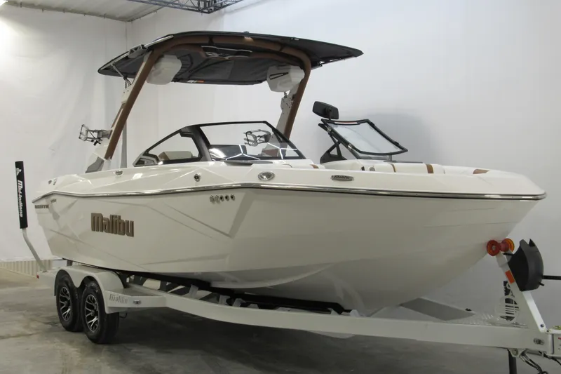 Slide: The Image of 2026 Malibu Wakesetter 23 LSV boat on trailer in showroom. - 1