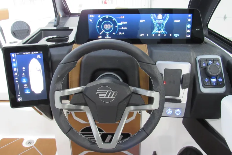 Slide: The Image of 2026 Malibu Wakesetter 23 LSV dashboard with advanced digital displays and controls. - 10