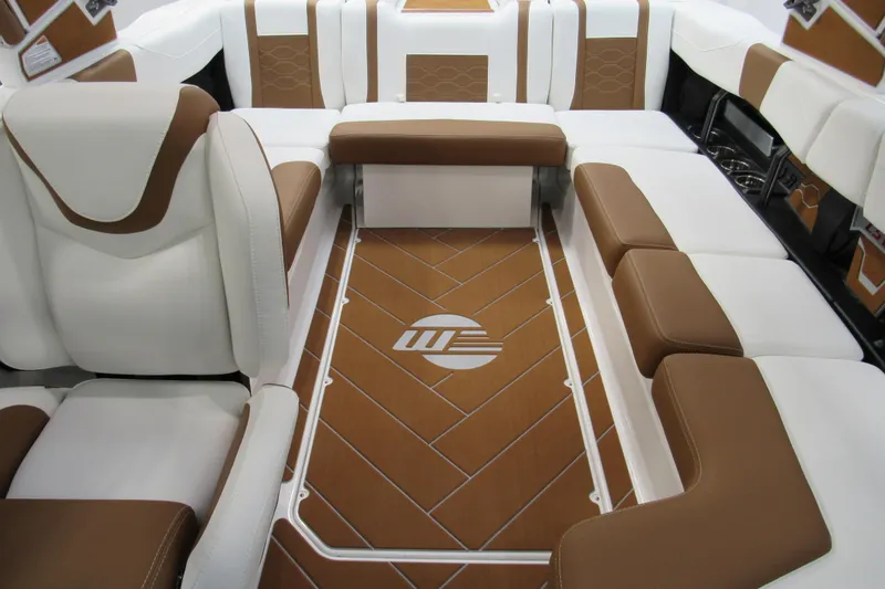 Slide: The Image of 2026 Malibu Wakesetter 23 LSV interior with luxurious brown and white seating. - 14