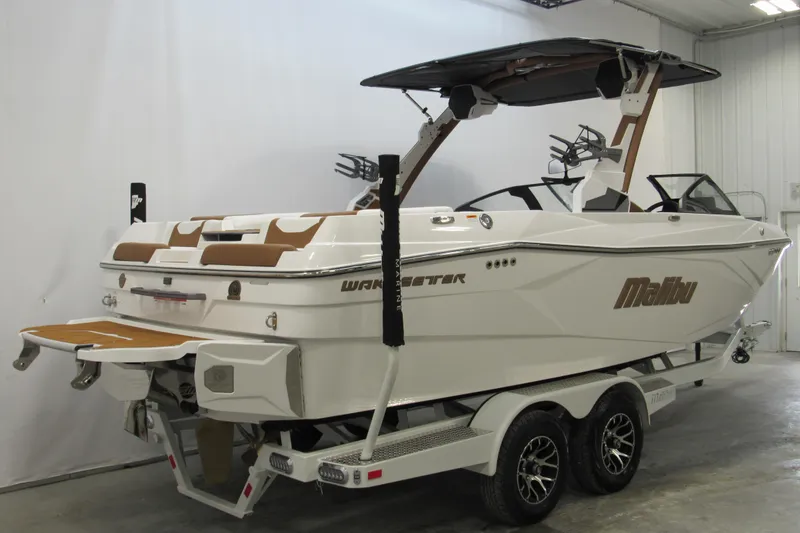 Slide: The Image of 2026 Malibu Wakesetter 23 LSV boat on trailer in indoor setting. - 2