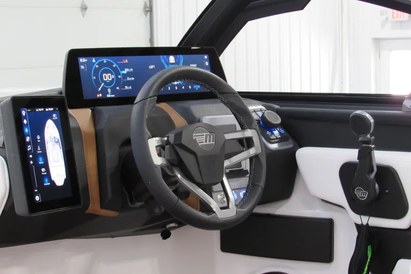 Slide: The Image of 2026 Malibu Wakesetter 23 LSV dashboard with advanced digital displays and steering wheel. - 9