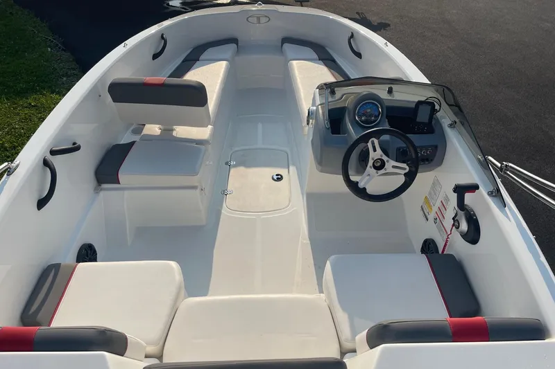 Slide: The Image of 2021 Tahoe T-16 boat interior with seating and steering wheel. - 10