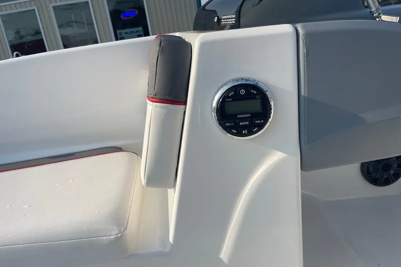 Slide: The Image of 2021 Tahoe T-16 boat interior with Kicker audio control panel. - 14