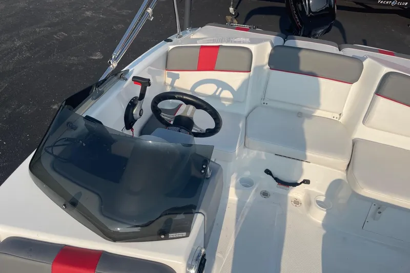 Slide: The Image of 2021 Tahoe T-16 boat interior with steering wheel and seating. - 20