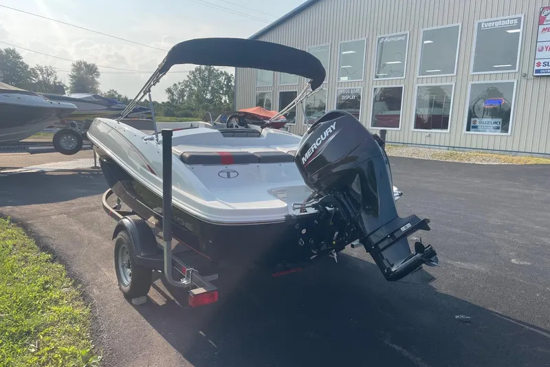 Slide: The Image of 2021 Tahoe T-16 boat with Mercury engine on trailer, parked outside dealership. - 4