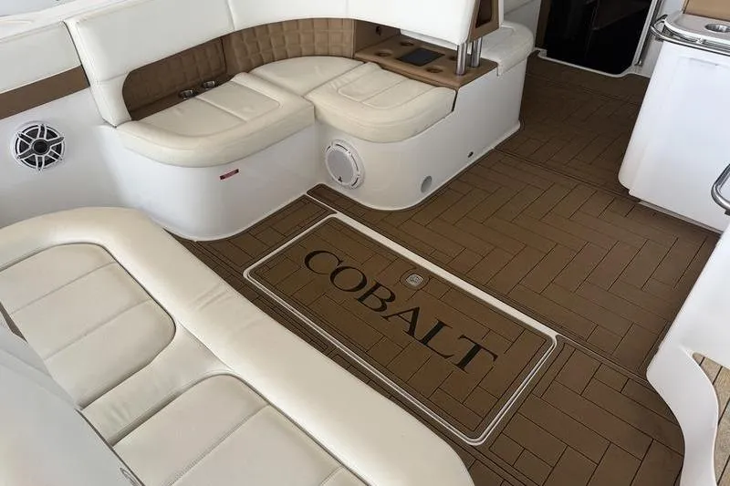 Slide: The Image of Luxurious interior of 2015 Cobalt A40 boat with beige seating and wood-patterned flooring. - 14
