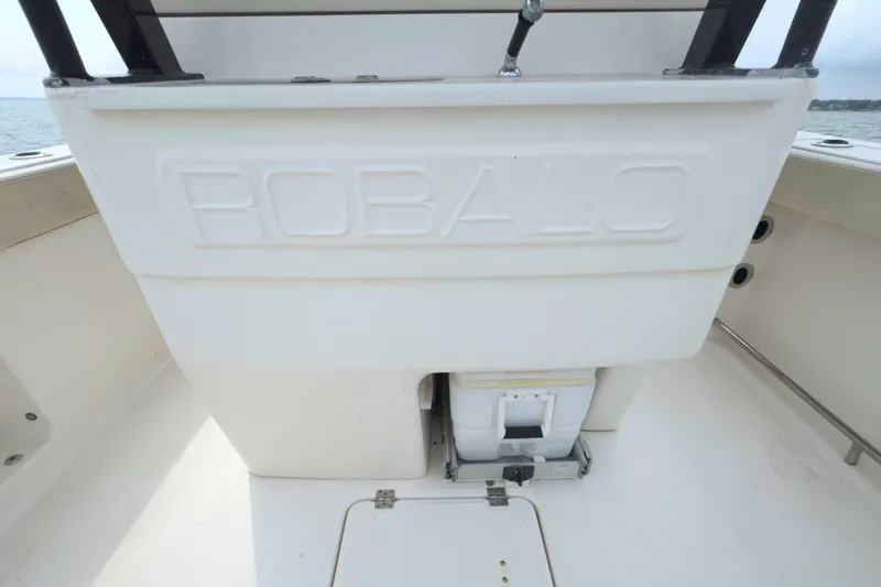 Slide: The Image of 2019 Robalo R272 Center Console boat interior with storage compartment. - 18