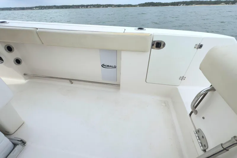 Slide: The Image of 2019 Robalo R272 Center Console boat interior with ocean view. - 19