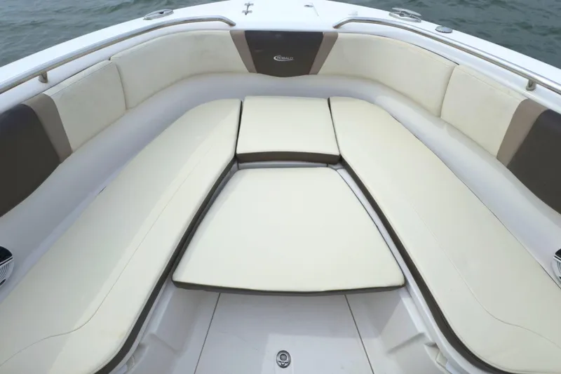 Slide: The Image of 2019 Robalo R272 Center Console boat with spacious cushioned seating area. - 27