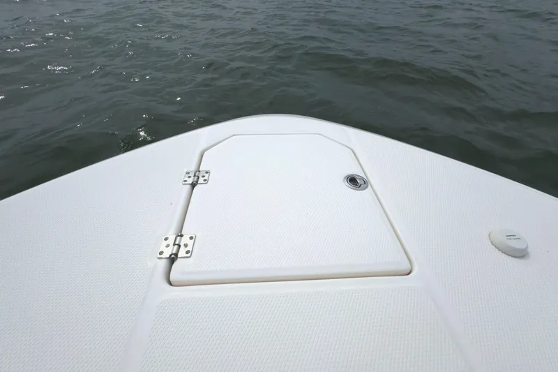 Slide: The Image of 2019 Robalo R272 Center Console boat deck on water. - 30