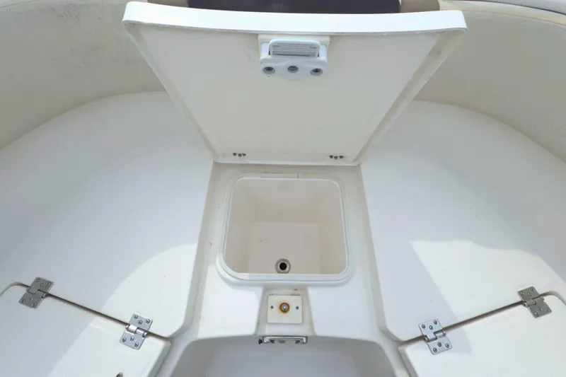 Slide: The Image of 2019 Robalo R272 Center Console storage compartment with open hatch. - 32