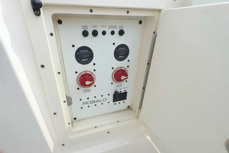 Slide: The Image of Control panel of 2019 Robalo R272 Center Console boat with power switches. - 38