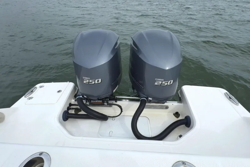Slide: The Image of 2019 Robalo R272 Center Console with twin Yamaha 250 outboard engines on water. - 39