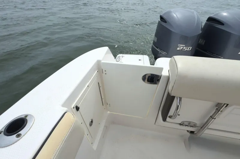 Slide: The Image of 2019 Robalo R272 Center Console boat with Yamaha 250 engines on water. - 8