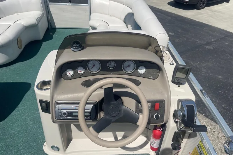 Slide: The Image of Kenwood stereo system on 2007 Premier 231 Alante boat dashboard. - 10