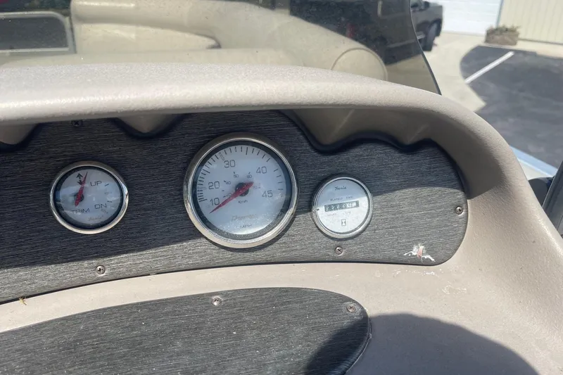 Slide: The Image of Control panel of a 2007 Premier 231 Alante boat with various switches. - 13