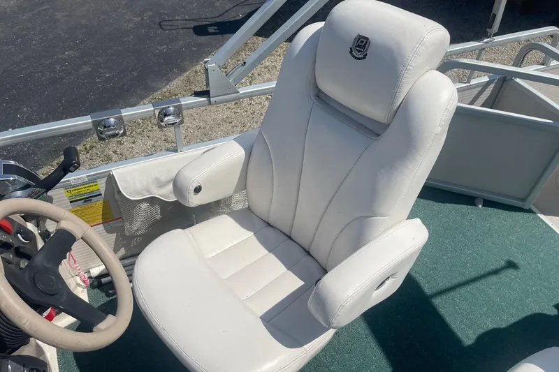 Slide: The Image of Luxurious seating on 2007 Premier 231 Alante boat with cup holders and speakers. - 16