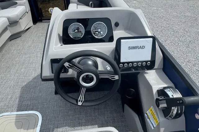 Slide: The Image of 2026 Barletta ARIA 22UC boat dashboard with steering wheel and Simrad display. - 16