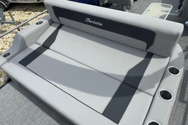Slide: The Image of 2026 Barletta ARIA 22UC boat seating with cup holders, featuring sleek gray upholstery. - 19