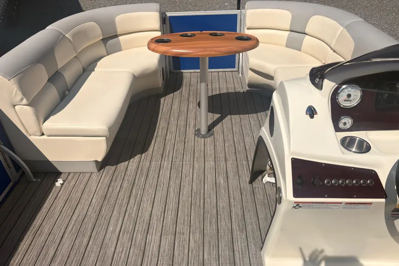 Slide: The Image of Luxurious 2022 Lexington 524 boat interior with plush seating and sleek control panel. - 12