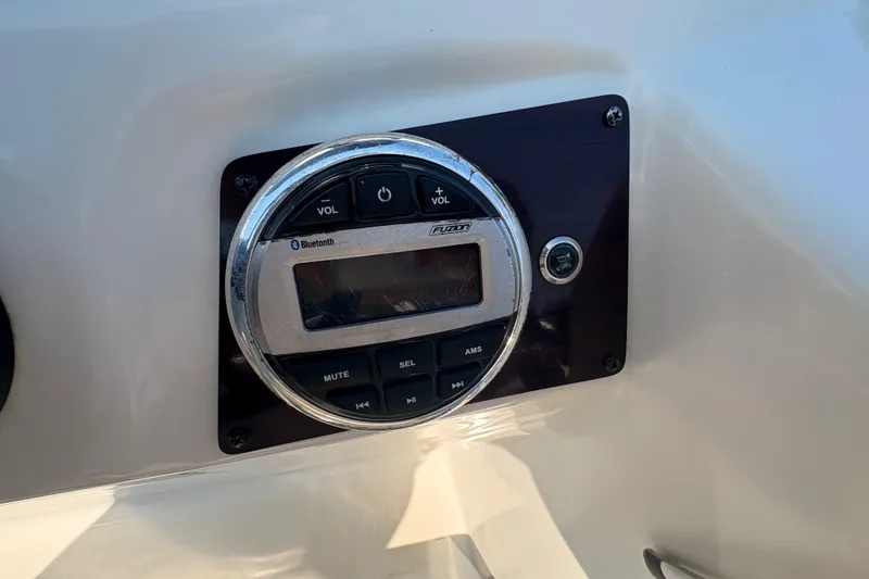 Slide: The Image of Bluetooth audio system on a 2022 Lexington 524 boat dashboard. - 19