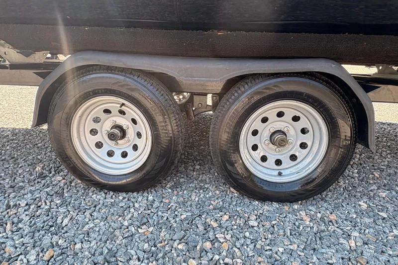 Slide: The Image of Dual wheels of a 2022 Lexington 524 trailer on gravel surface. - 6