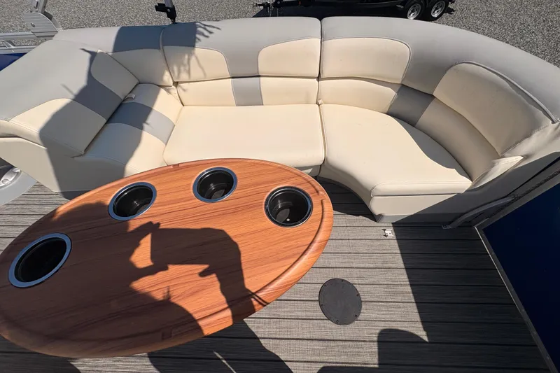 Slide: The Image of Luxurious Lexington 524 boat interior with cream seating and wooden table, 2022 model. - 9