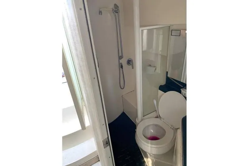 Slide: The Image of Bathroom interior of 1999 Wellcraft 45 Excalibur boat with shower and toilet. - 10