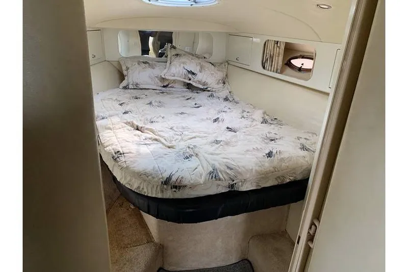 Slide: The Image of Cozy cabin interior of 1999 Wellcraft 45 Excalibur with comfortable bedding. - 5