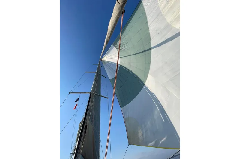Slide: The Image of Sail of 2008 Hanse 470e yacht against cloudy sky, showcasing rigging details. - 26