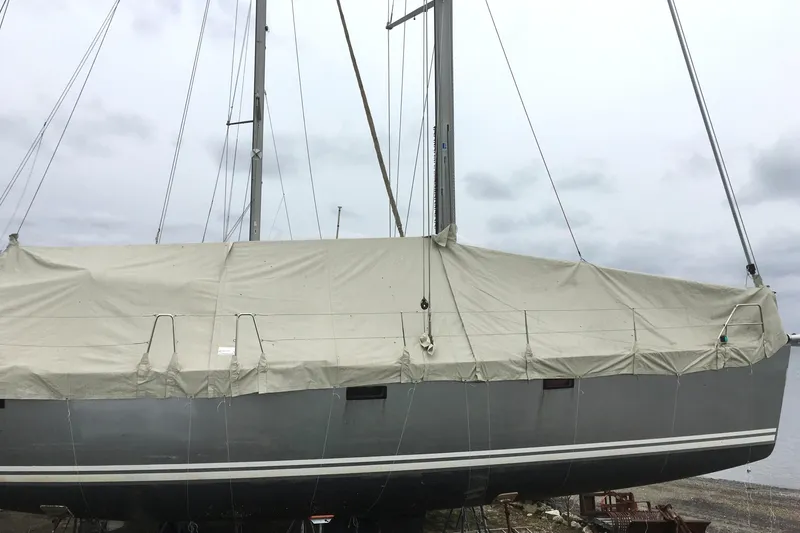 Slide: The Image of Engine compartment of a 2008 Hanse 470e sailboat, featuring a Yanmar engine. - 28