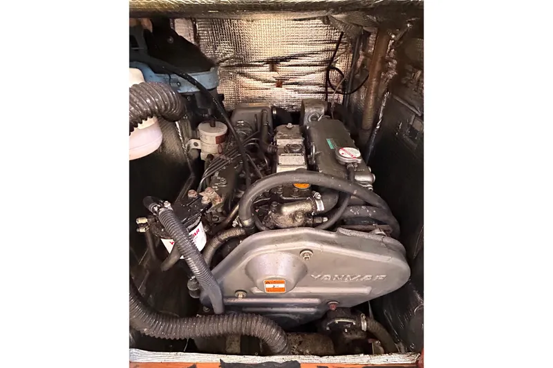 Slide: The Image of Engine compartment of a 2008 Hanse 470e sailboat, featuring a Yanmar engine. - 30