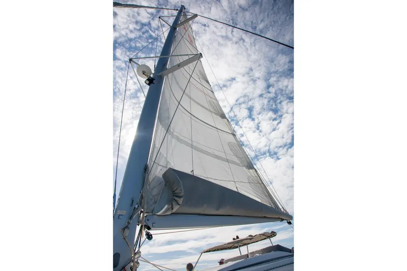 Slide: The Image of Sail of 2018 Fountaine Pajot Helia 44 Evolution against a cloudy sky. - 13