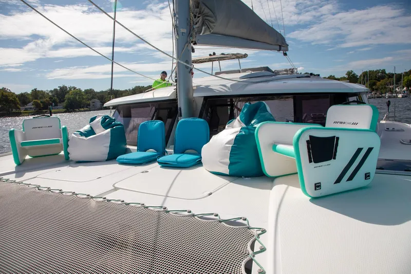 Slide: The Image of 2018 Fountaine Pajot Helia 44 Evolution catamaran with turquoise seating on deck. - 18
