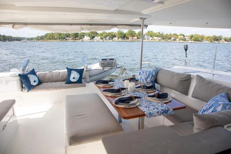 Slide: The Image of Luxurious 2018 Fountaine Pajot Helia 44 Evolution yacht with elegant outdoor dining setup. - 21