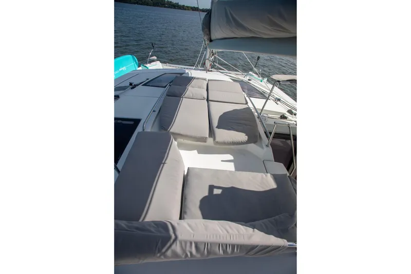 Slide: The Image of 2018 Fountaine Pajot Helia 44 Evolution catamaran with spacious deck and cushioned seating. - 28