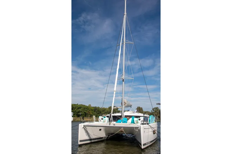 Slide: The Image of 2018 Fountaine Pajot Helia 44 Evolution catamaran on water, clear sky background. - 3