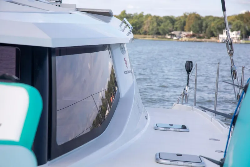 Slide: The Image of 2018 Fountaine Pajot Helia 44 Evolution catamaran on serene water, showcasing sleek design. - 30