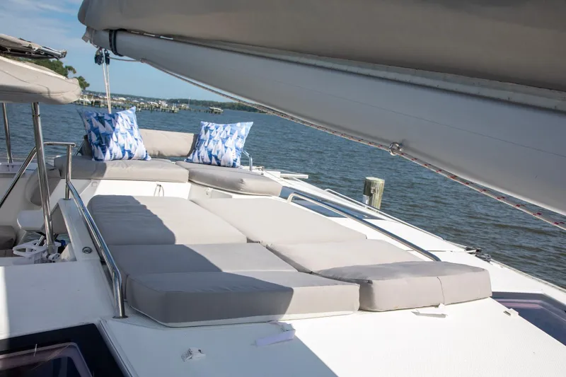 Slide: The Image of Luxurious deck of 2018 Fountaine Pajot Helia 44 Evolution catamaran with cushions and scenic view. - 32
