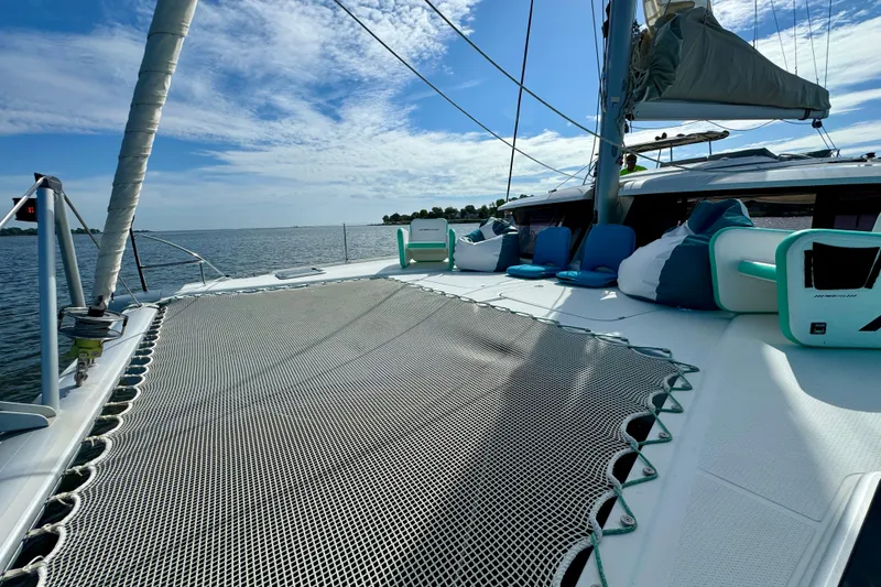 Slide: The Image of 2018 Fountaine Pajot Helia 44 Evolution catamaran on calm waters under a blue sky. - 33