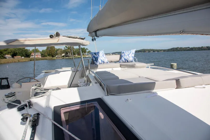 Slide: The Image of 2018 Fountaine Pajot Helia 44 Evolution catamaran with spacious deck and scenic water view. - 34