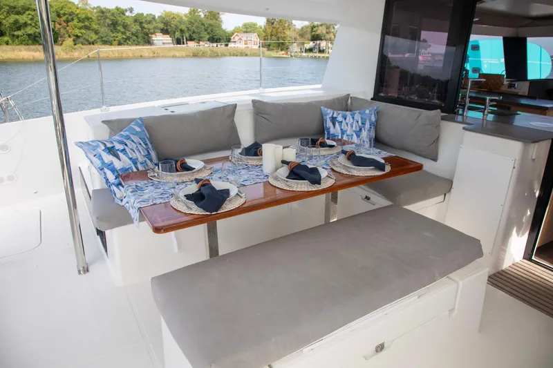 Slide: The Image of Outdoor dining area on 2018 Fountaine Pajot Helia 44 Evolution catamaran, set for a meal. - 39