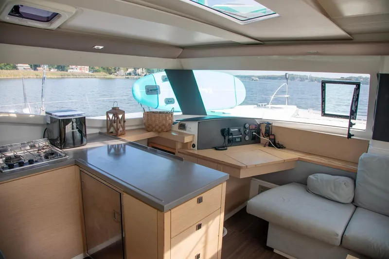 Slide: The Image of Interior of 2018 Fountaine Pajot Helia 44 Evolution catamaran with modern kitchen and navigation area. - 51