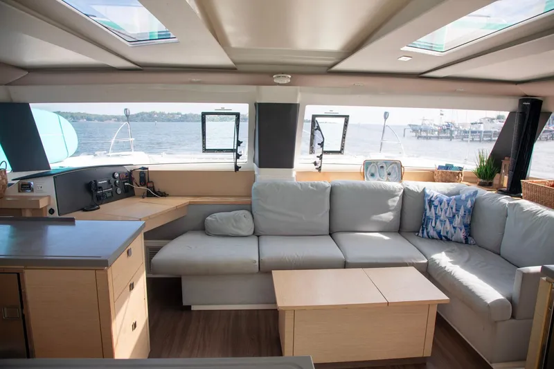 Slide: The Image of Luxurious interior of 2018 Fountaine Pajot Helia 44 Evolution catamaran with spacious seating and scenic views. - 53