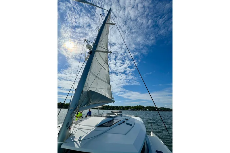Slide: The Image of 2018 Fountaine Pajot Helia 44 Evolution sailing under a bright blue sky. - 6