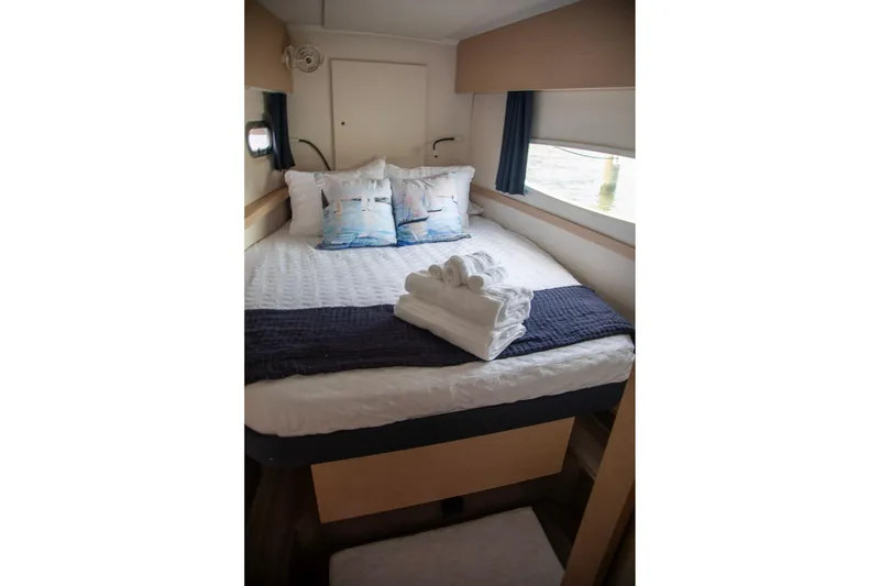 Slide: The Image of Cozy cabin interior of 2018 Fountaine Pajot Helia 44 Evolution with neatly arranged bed and towels. - 67