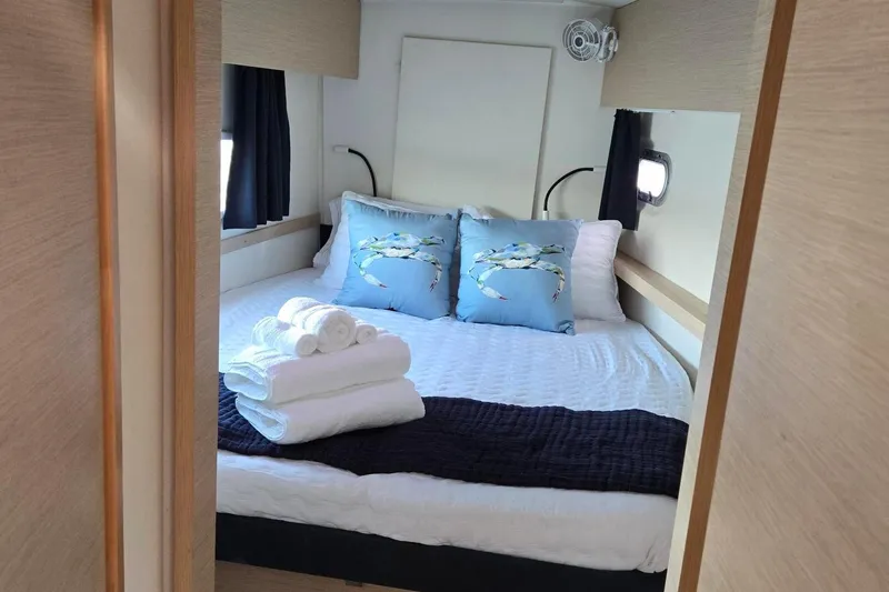 Slide: The Image of Cozy bedroom in 2018 Fountaine Pajot Helia 44 Evolution yacht with nautical decor. - 73
