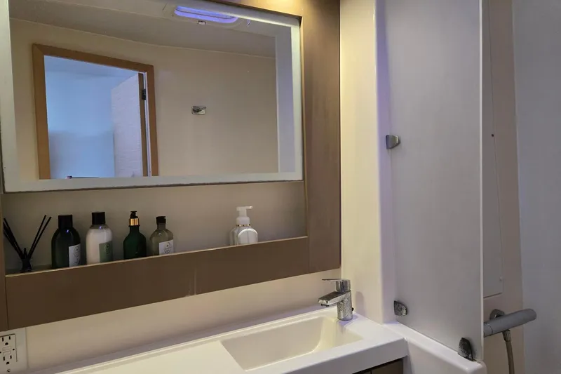 Slide: The Image of Bathroom interior of 2018 Fountaine Pajot Helia 44 Evolution yacht with mirror and toiletries. - 76